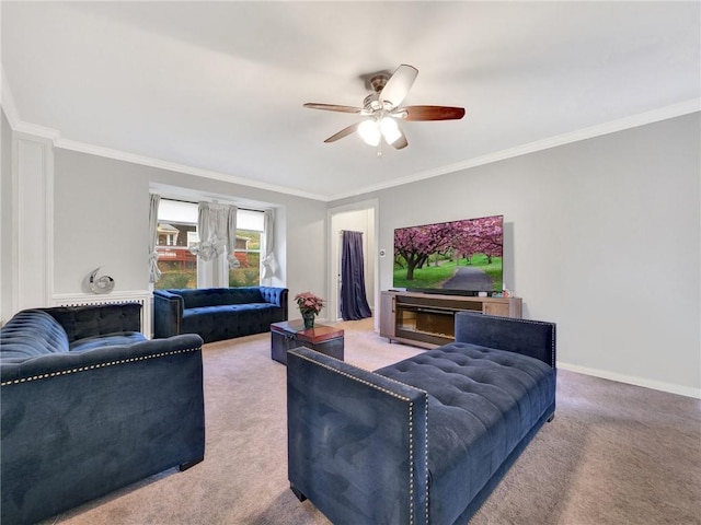 living room featuring carpet flooring, ceiling fan, and ornamental molding