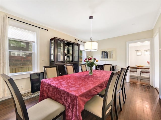 10 Columbia Ave, Hartsdale, NY 10530 - dining area with plenty of natural light, dark wood-style flooring, baseboards, and crown molding