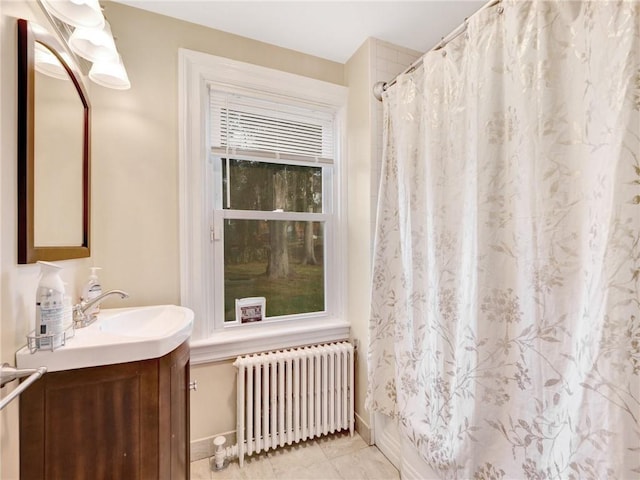 10 Columbia Ave, Hartsdale, NY 10530 - full bath featuring radiator heating unit, vanity, baseboards, a shower with shower curtain, and tile patterned flooring