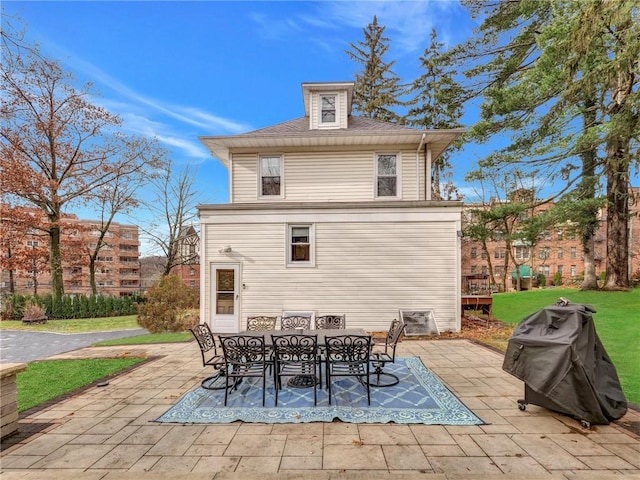 back of house with a patio area