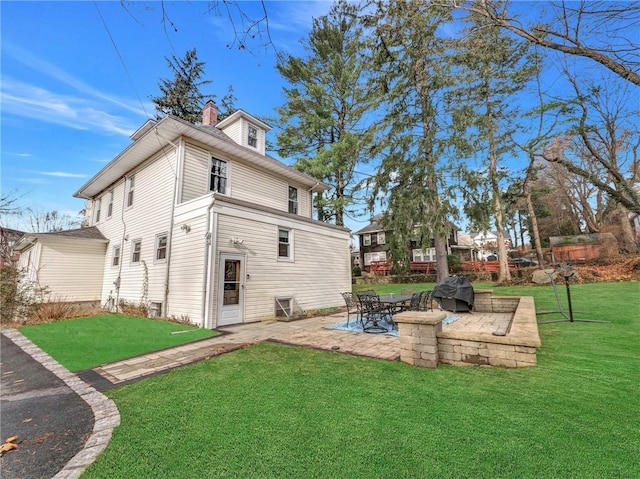 10 Columbia Ave, Hartsdale, NY 10530 - rear view of property featuring a patio, a yard, and a chimney