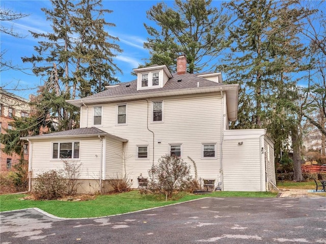 10 Columbia Ave, Hartsdale, NY 10530 - back of house featuring a chimney and roof with shingles