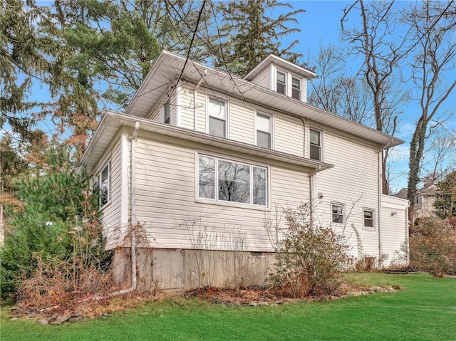 view of home's exterior featuring a lawn