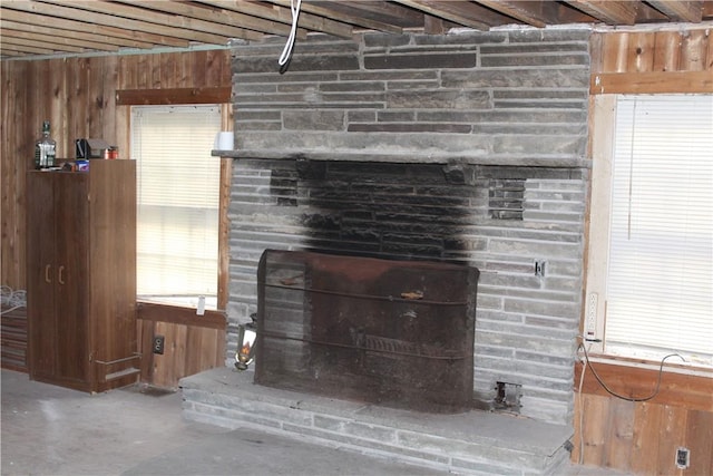 room details with wooden walls and concrete flooring