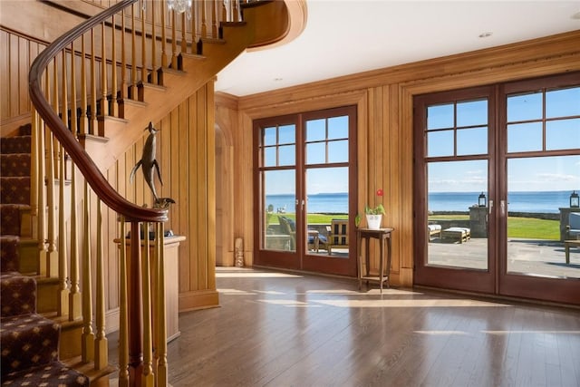 12 Island Dr, Rye, NY 10580 - doorway featuring hardwood / wood-style flooring, plenty of natural light, a water view, and wooden walls