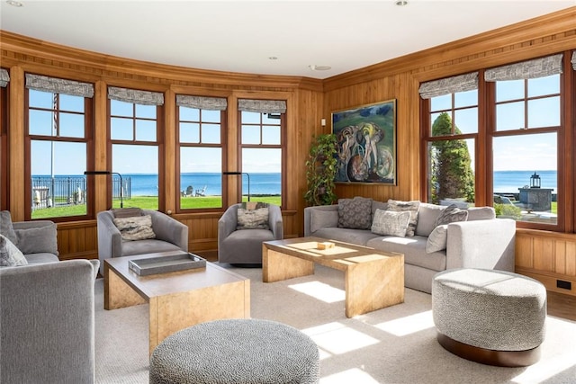 12 Island Dr, Rye, NY 10580 - living room with a water view, light colored carpet, and wooden walls