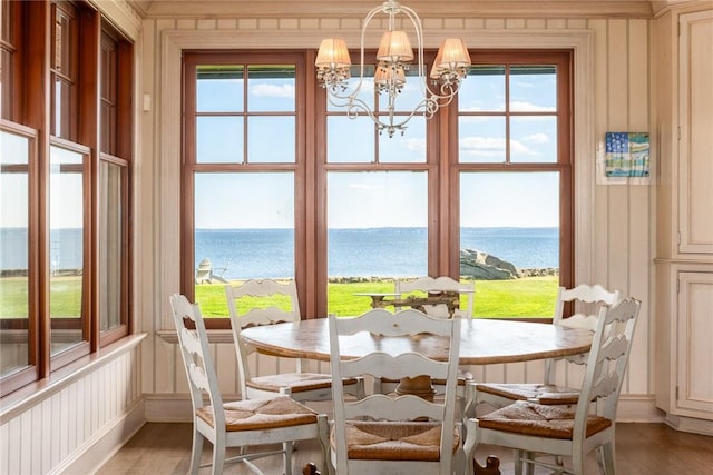 12 Island Dr, Rye, NY 10580 - dining area featuring plenty of natural light, a water view, and wood-type flooring