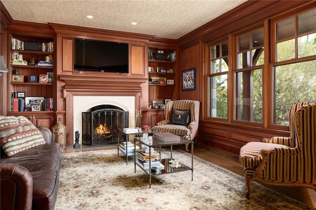 12 Island Dr, Rye, NY 10580 - sitting room with a wealth of natural light, built in features, wood-type flooring, and ornamental molding