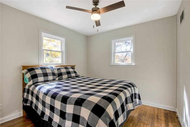 bedroom featuring hardwood / wood-style flooring and ceiling fan