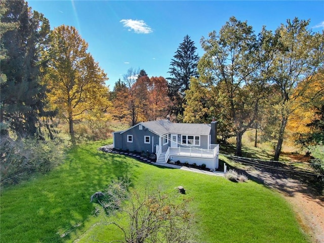 exterior space featuring a front yard and a deck