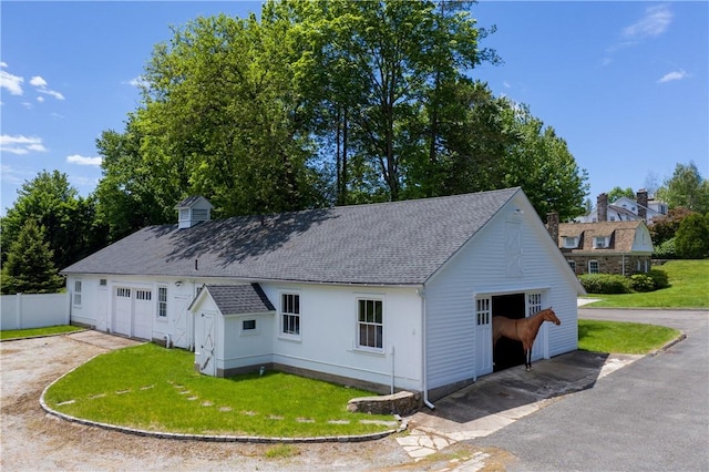 exterior space with a front yard and a garage