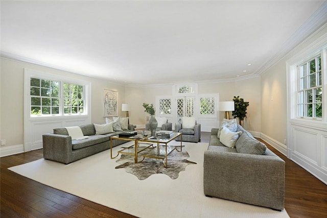 living room with dark hardwood / wood-style flooring and ornamental molding