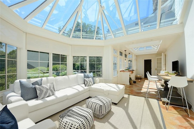 sunroom / solarium featuring a skylight and a wealth of natural light