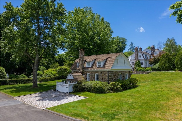 view of home's exterior with a yard