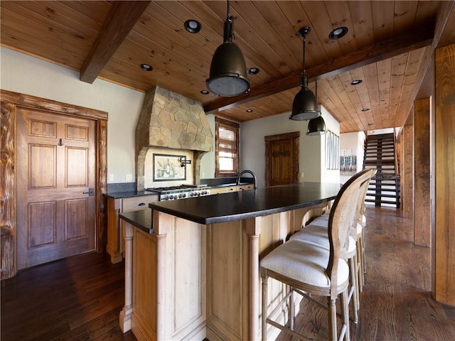 kitchen featuring beam ceiling, pendant lighting, wooden ceiling, and dark hardwood / wood-style floors