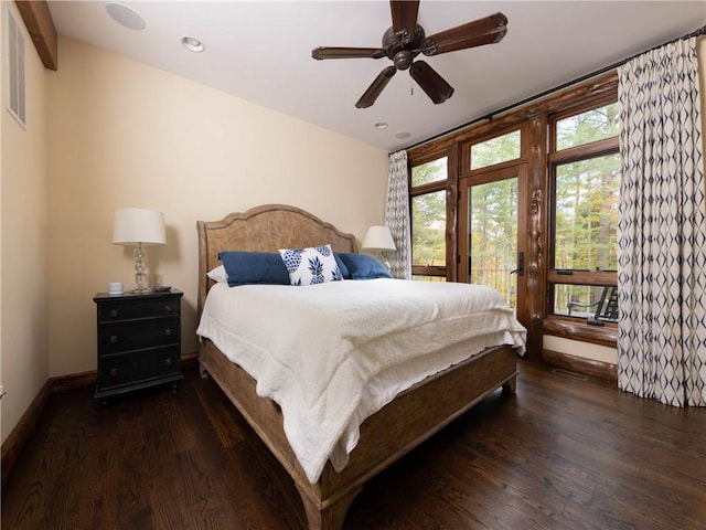 bedroom featuring dark hardwood / wood-style floors and ceiling fan