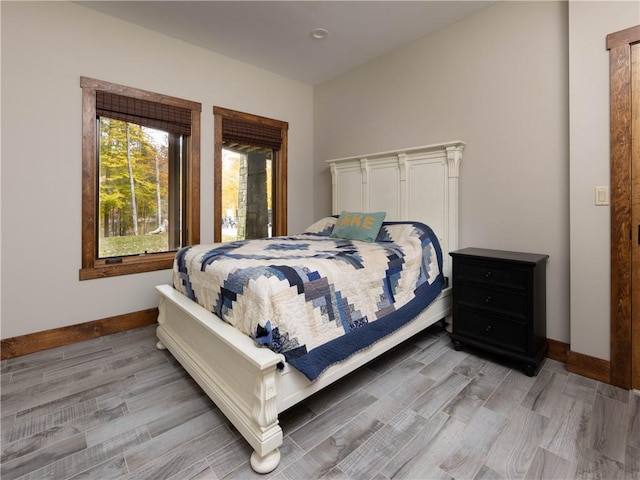 bedroom with hardwood / wood-style flooring