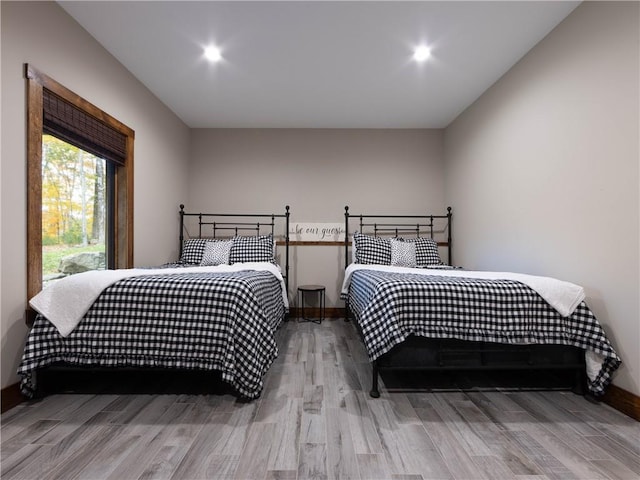 bedroom with light hardwood / wood-style floors