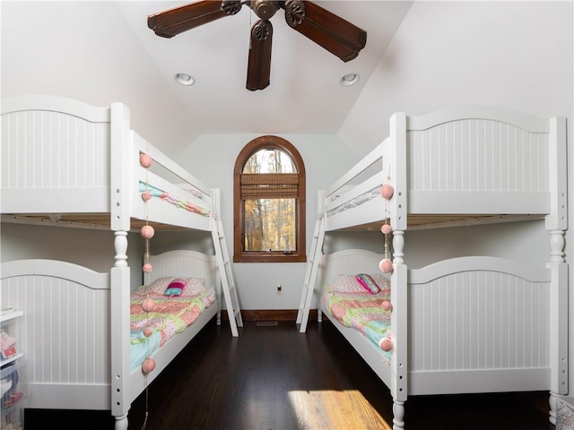 bedroom featuring ceiling fan, dark hardwood / wood-style floors, and vaulted ceiling