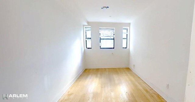 spare room featuring light hardwood / wood-style flooring