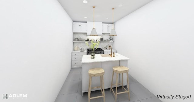 bar featuring backsplash, white cabinets, tile patterned floors, sink, and decorative light fixtures