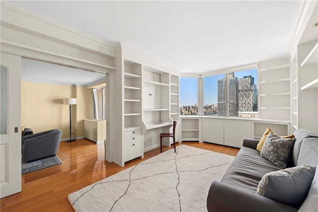 living room featuring hardwood / wood-style floors and ornamental molding