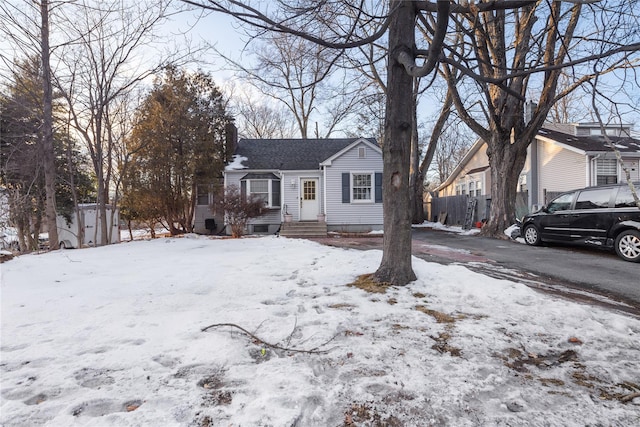 bungalow-style home with entry steps