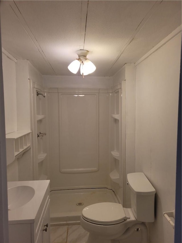 full bathroom with a textured ceiling, vanity, a shower stall, and toilet