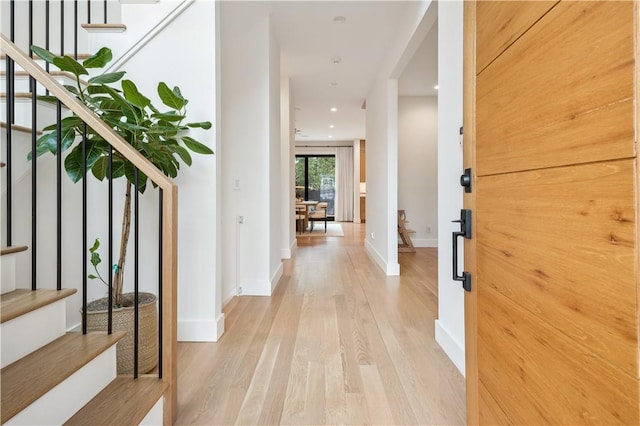 hall with light hardwood / wood-style flooring