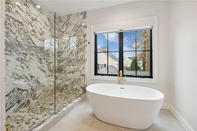 bathroom featuring shower with separate bathtub and tile patterned floors