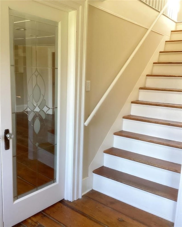 stairway with wood-type flooring