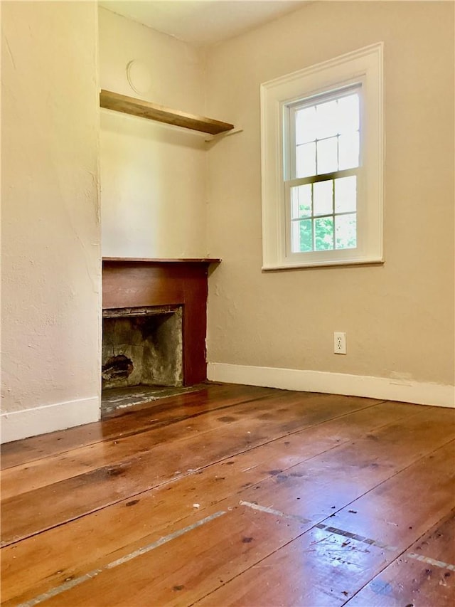 unfurnished living room featuring hardwood / wood-style floors