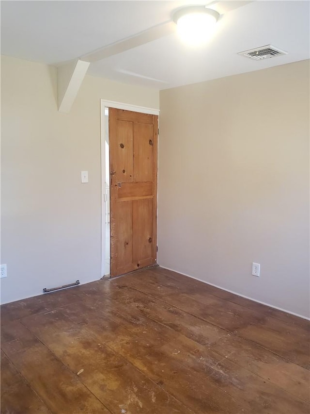 unfurnished room featuring dark hardwood / wood-style floors