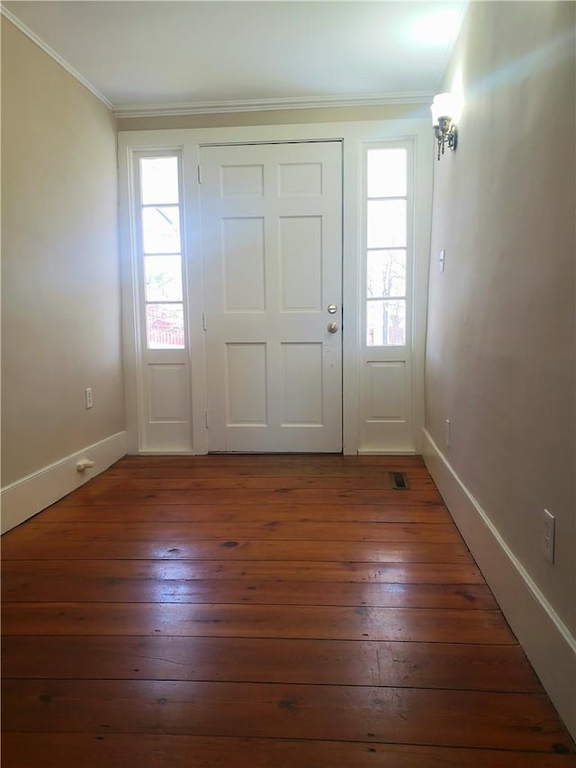 entryway with dark hardwood / wood-style flooring and ornamental molding