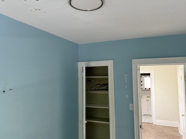 1246 Troy Ave, Brooklyn, NY 11203 - unfurnished bedroom featuring carpet flooring, a closet, and baseboards