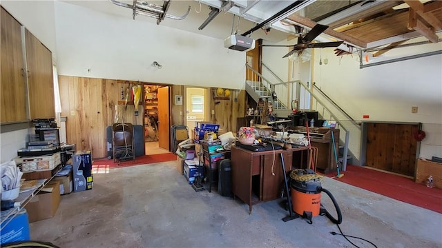 interior space with wood walls and a garage door opener