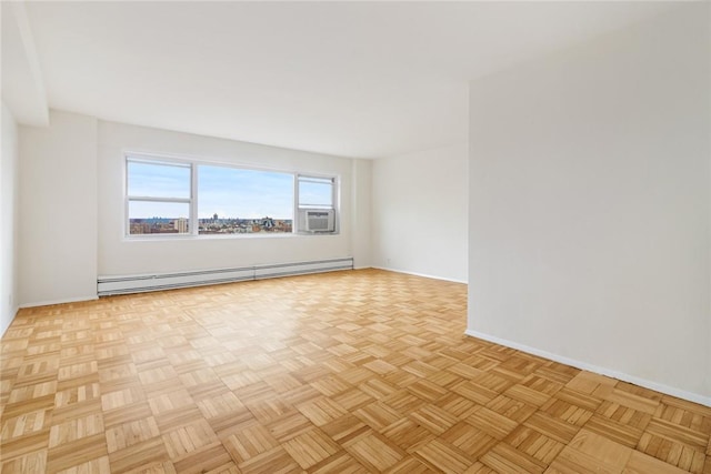 unfurnished room featuring light parquet floors, cooling unit, and a baseboard heating unit