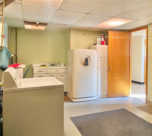 clothes washing area featuring cabinets