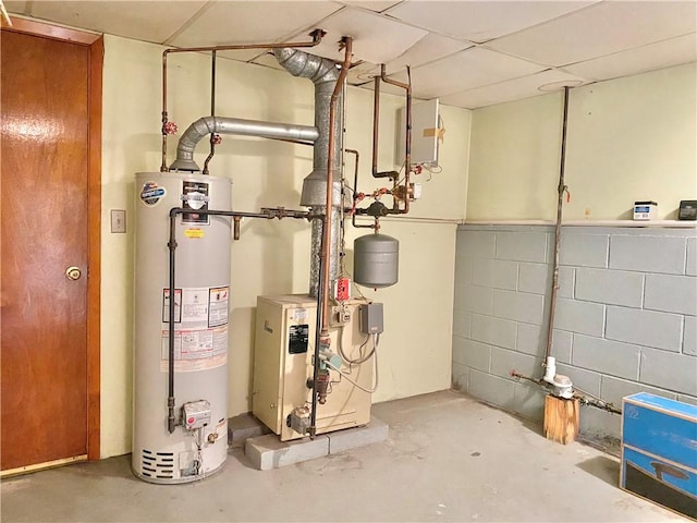 utility room featuring water heater