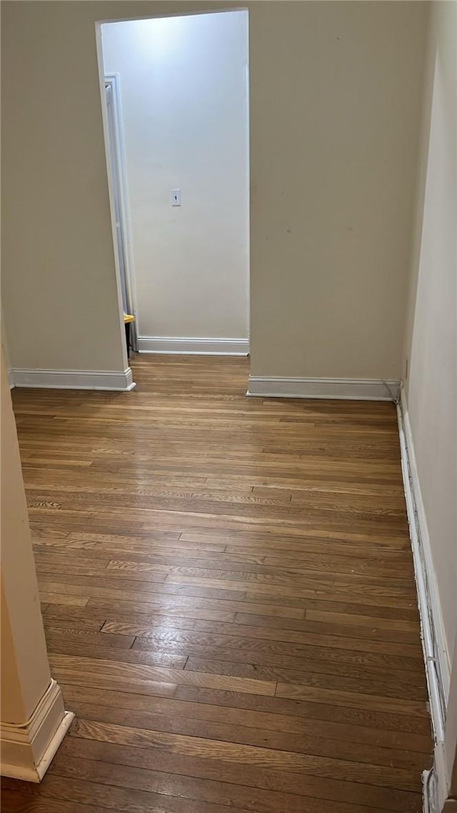 unfurnished room featuring dark hardwood / wood-style floors