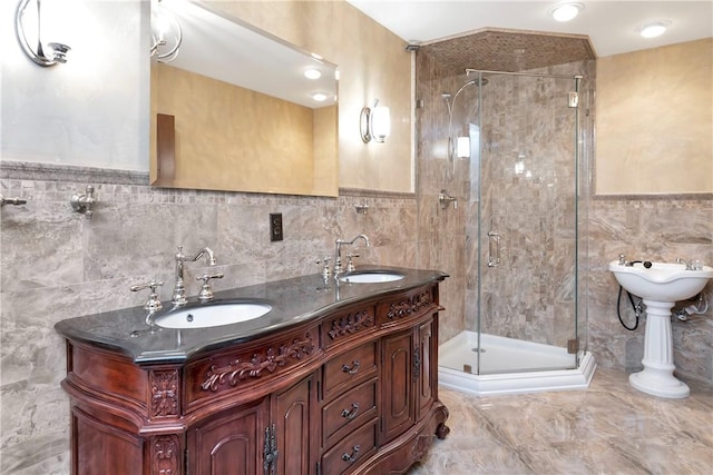 bathroom with a bidet, vanity, a shower with shower door, and tile walls