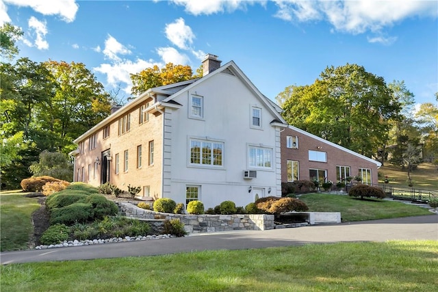 view of side of home featuring a yard