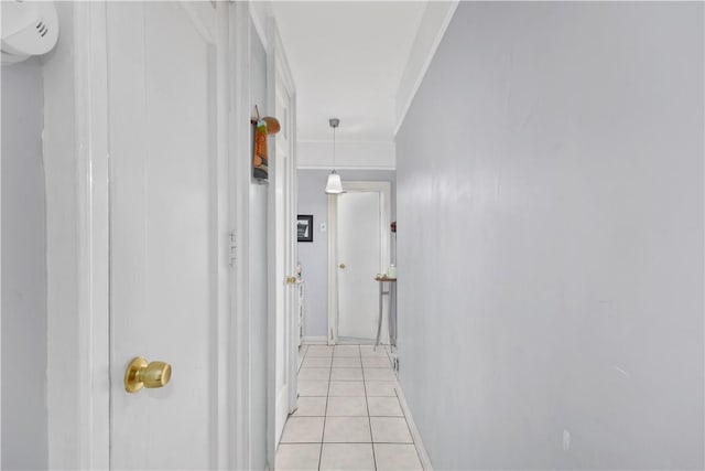 hall featuring light tile patterned floors