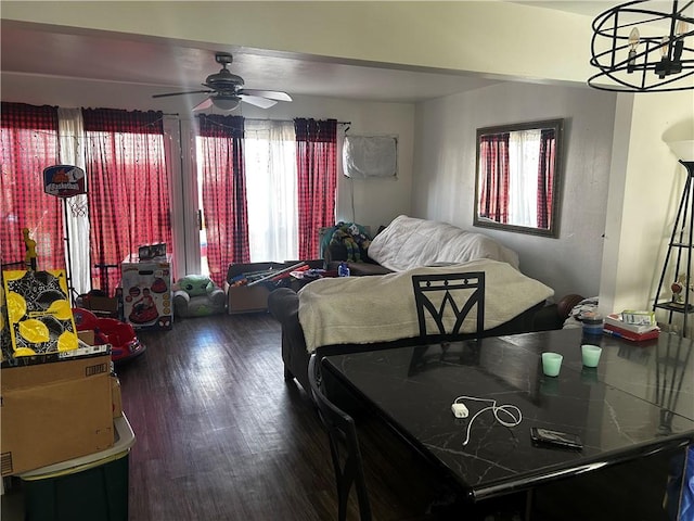 dining area featuring a ceiling fan and wood finished floors