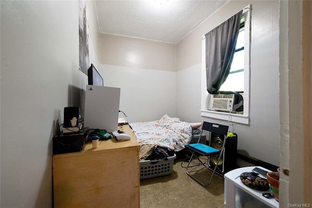 carpeted bedroom with cooling unit and a textured ceiling