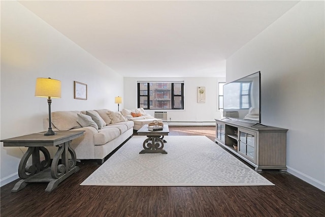 living room featuring dark hardwood / wood-style flooring, a wall unit AC, and baseboard heating