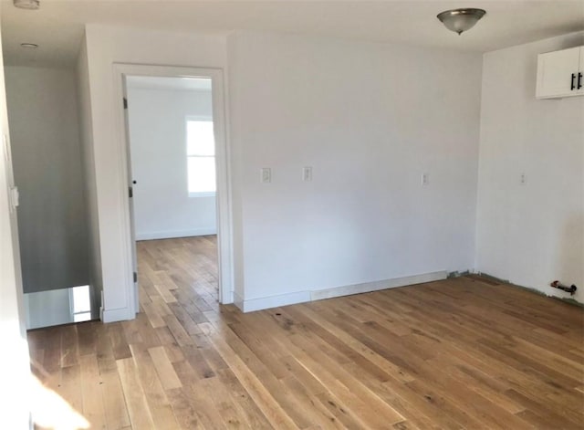 spare room with light wood-type flooring