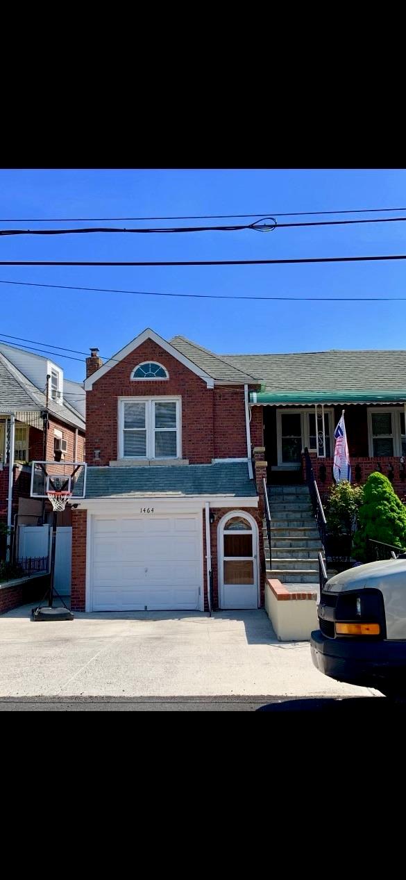 1464 William Pl, Bronx, NY 10461 - view of front of house featuring a garage