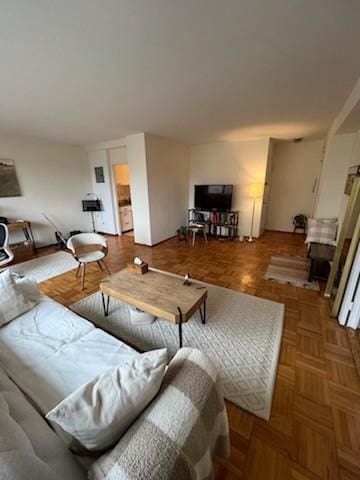 living room featuring parquet flooring