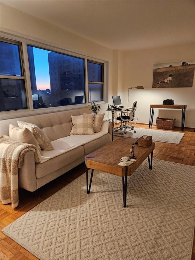 living room featuring parquet flooring